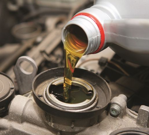 Pour oil into Suzuki Engine