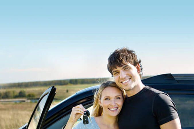 Smiling couple with keys